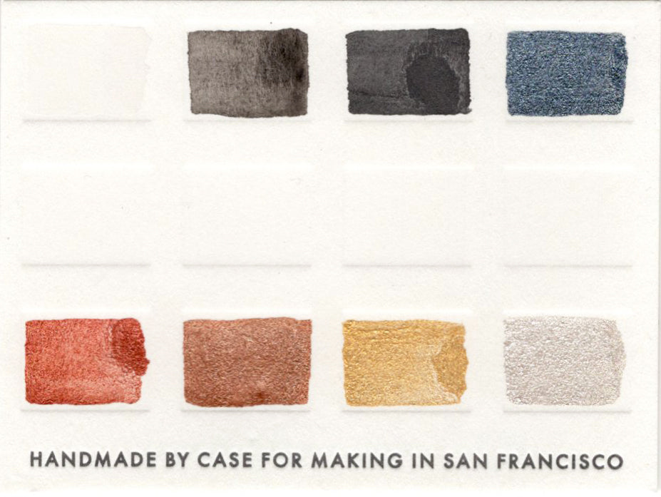 A close up of the pre-painted Monochromatic Black/White/Metalllic Palette swatch card.