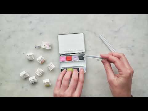 How To Fill Your Palette Video - shows the process of opening your set, unwrapping the watercolors, and swatching out the colors on the swatch card.