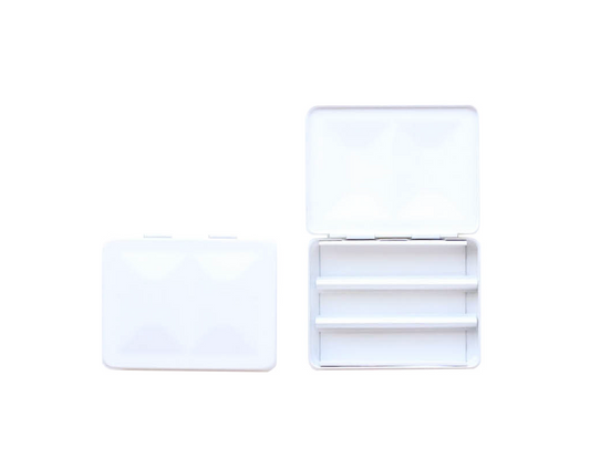 The CfM Simple Travel Palette in Matte White.  Shown closed and open, side by side. The open case features wells in the lid for mixing colors and can fit a removable swatch card.