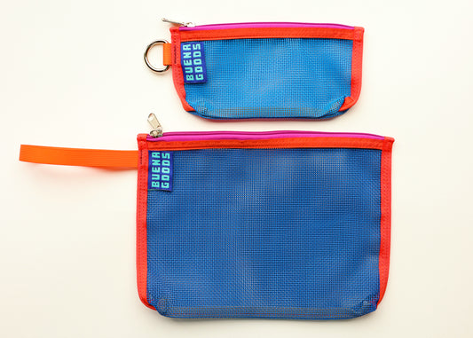 Two mesh zip pouches in blue with red-orange trim and a small metal key ring, shown on a plain white background. One pouch has an orange loop handle, and both have a visible sewn fabric tag reading 'Buena Goods'.