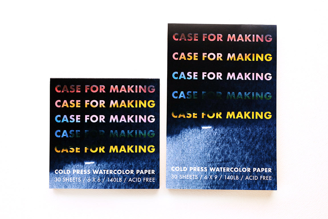 The Case for Making brand 6" x 6" and 6" x 9" Cold Press Watercolor Paper pads side by side.  Closed pads, top tape-bound.