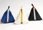 Three triangular pouches against a white background. One is white and the other two are blue and black denim.