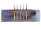 5 mini travel brushes lined up on an indigo watercolor swipe.