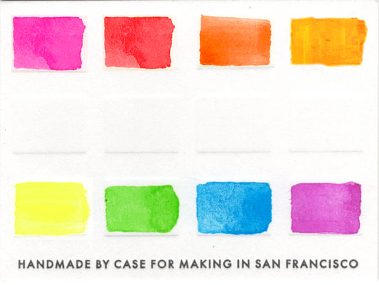 Close-up of the swatch card for the 8 Fluorescent Color Travel Set that features 8 fluorescent colors.